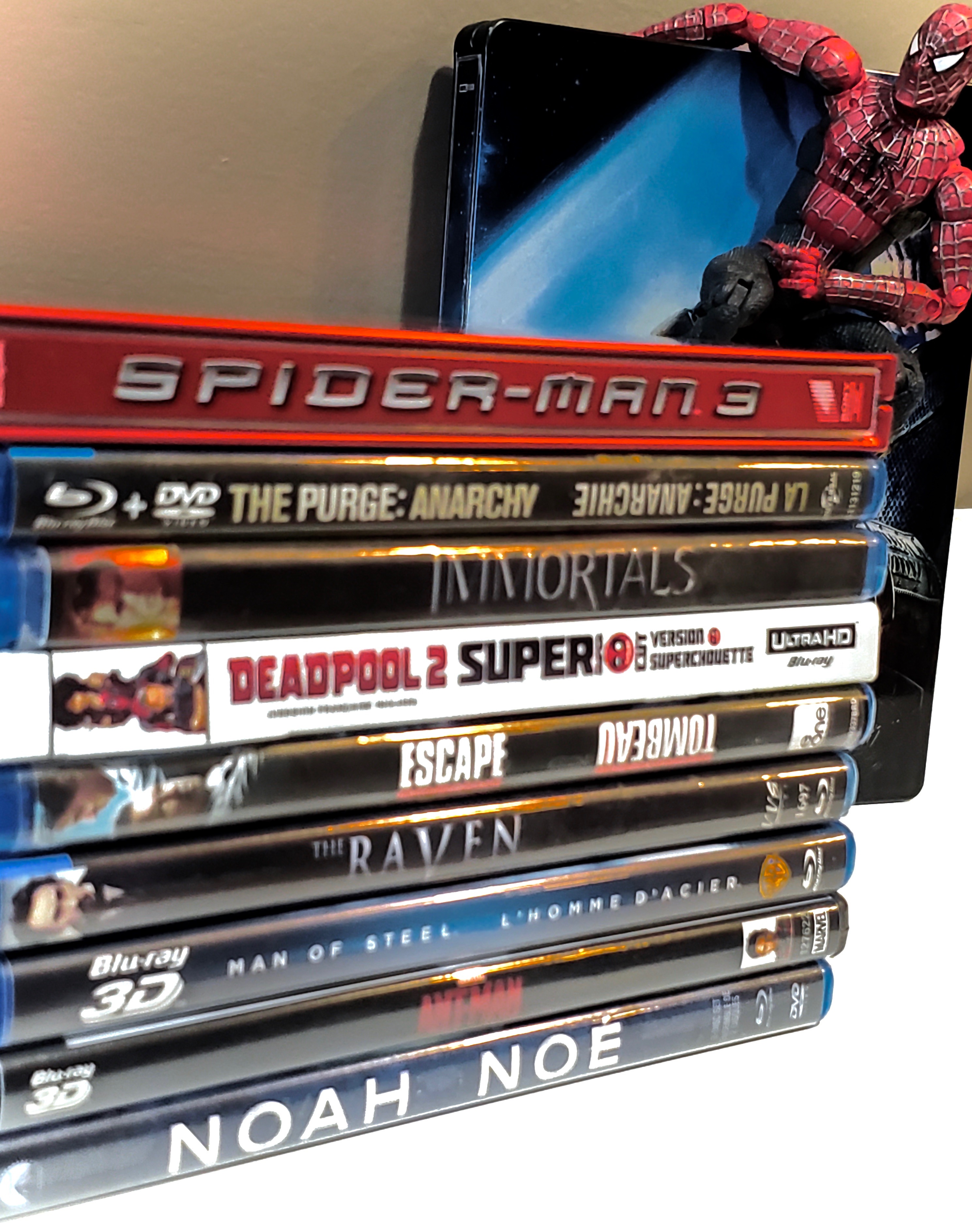 bluray collection with Spider-Man in the background